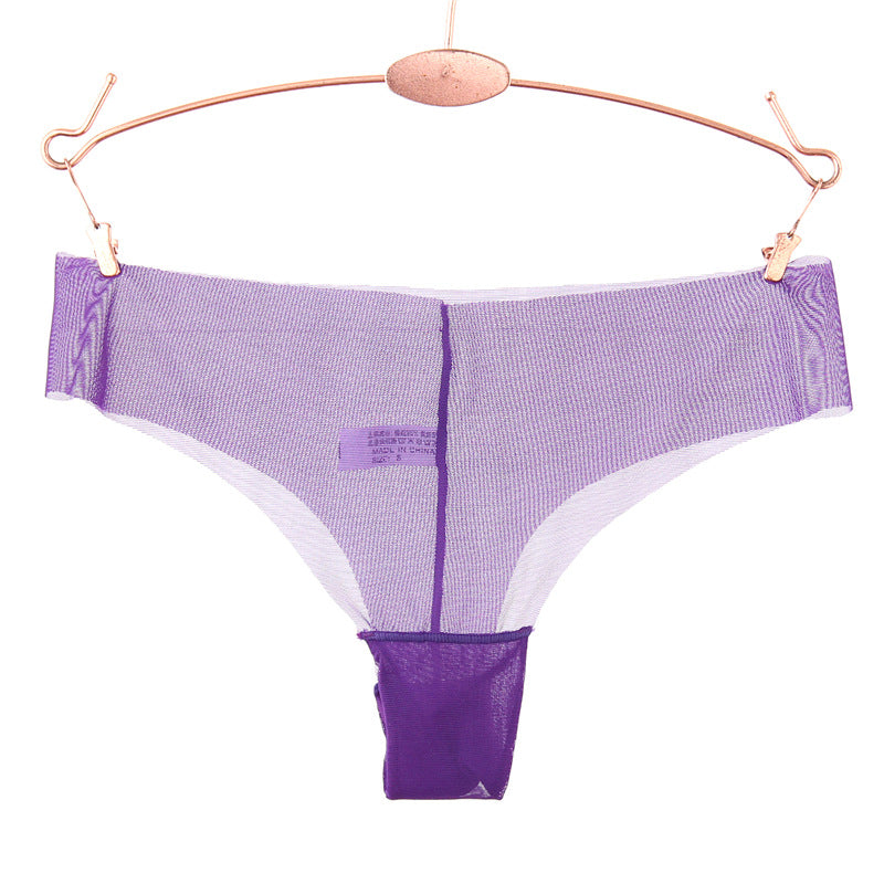 Panty string en maille transparente du bord brut