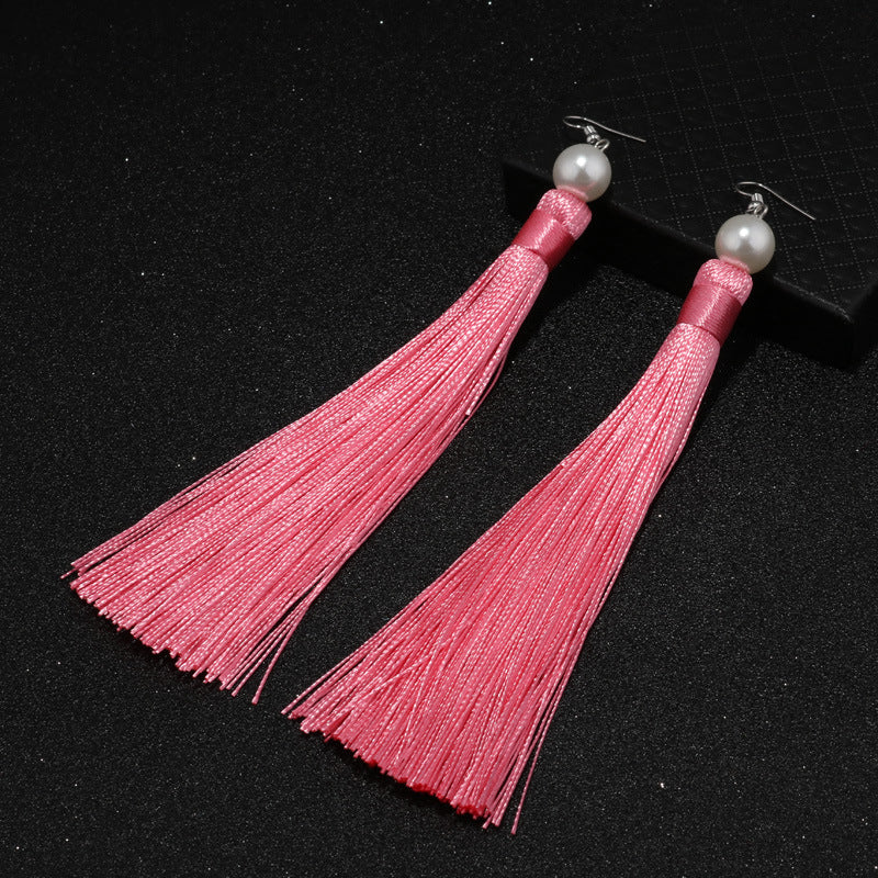 Aretes colgantes de perla con borla roja